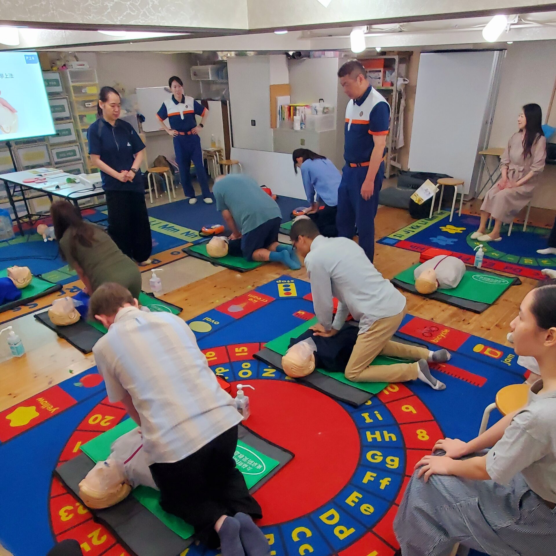 MLS staff reviewing first aid instruction materials
