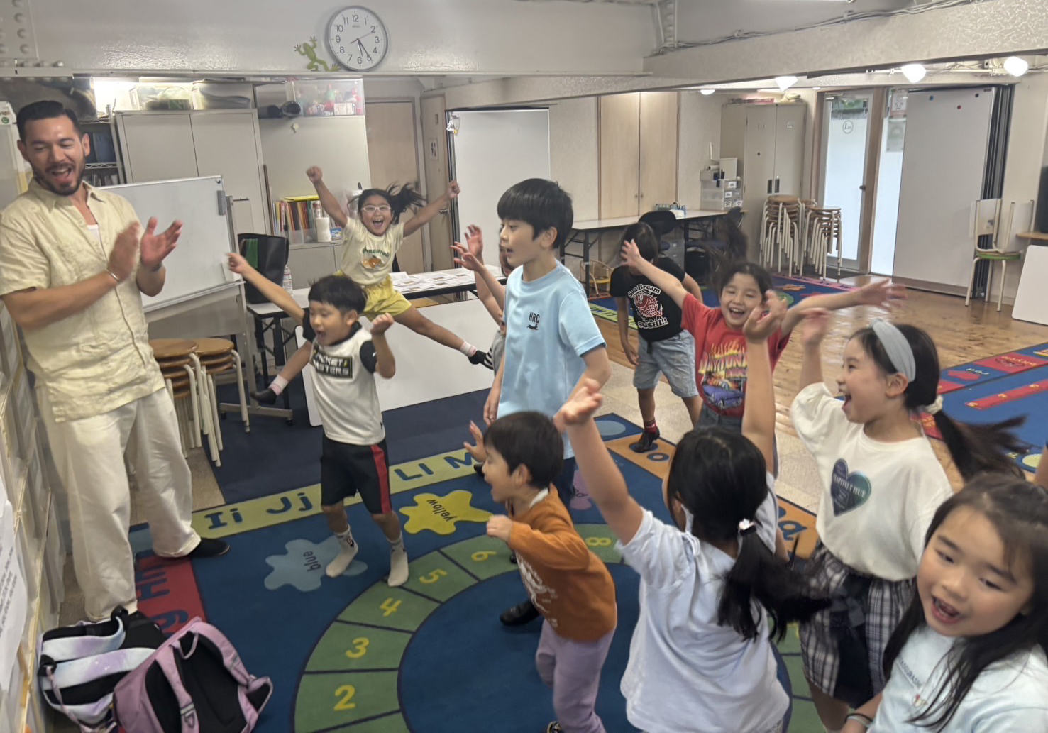 Mini Production students energetically rehearsing Pinocchio with big smiles